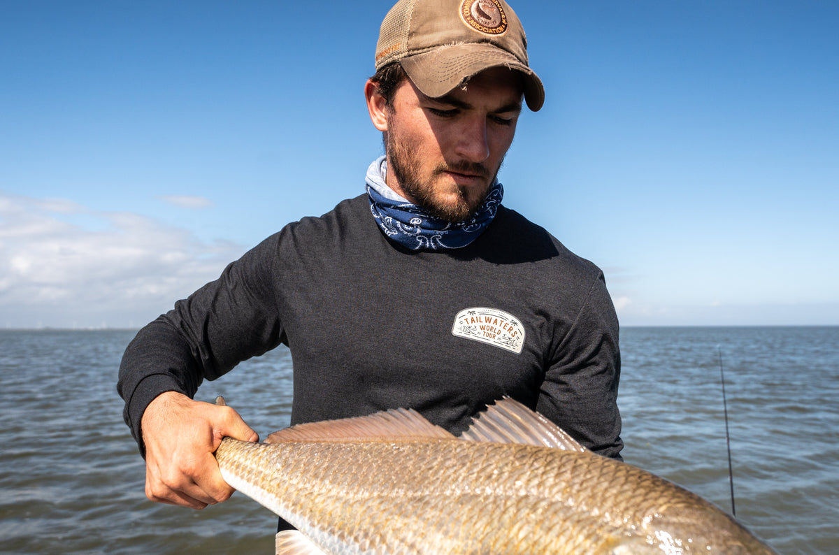 Tailwaters World Tour Merch spotted on the Texas Coast with a Redfish in hand